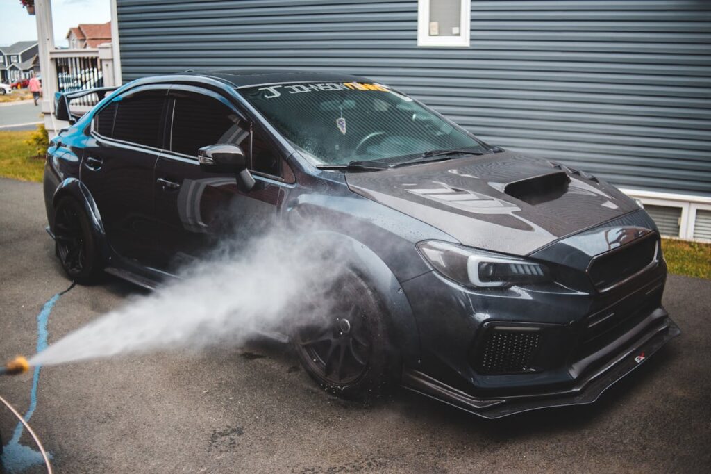 Luxury automobile at cars wash in daytime